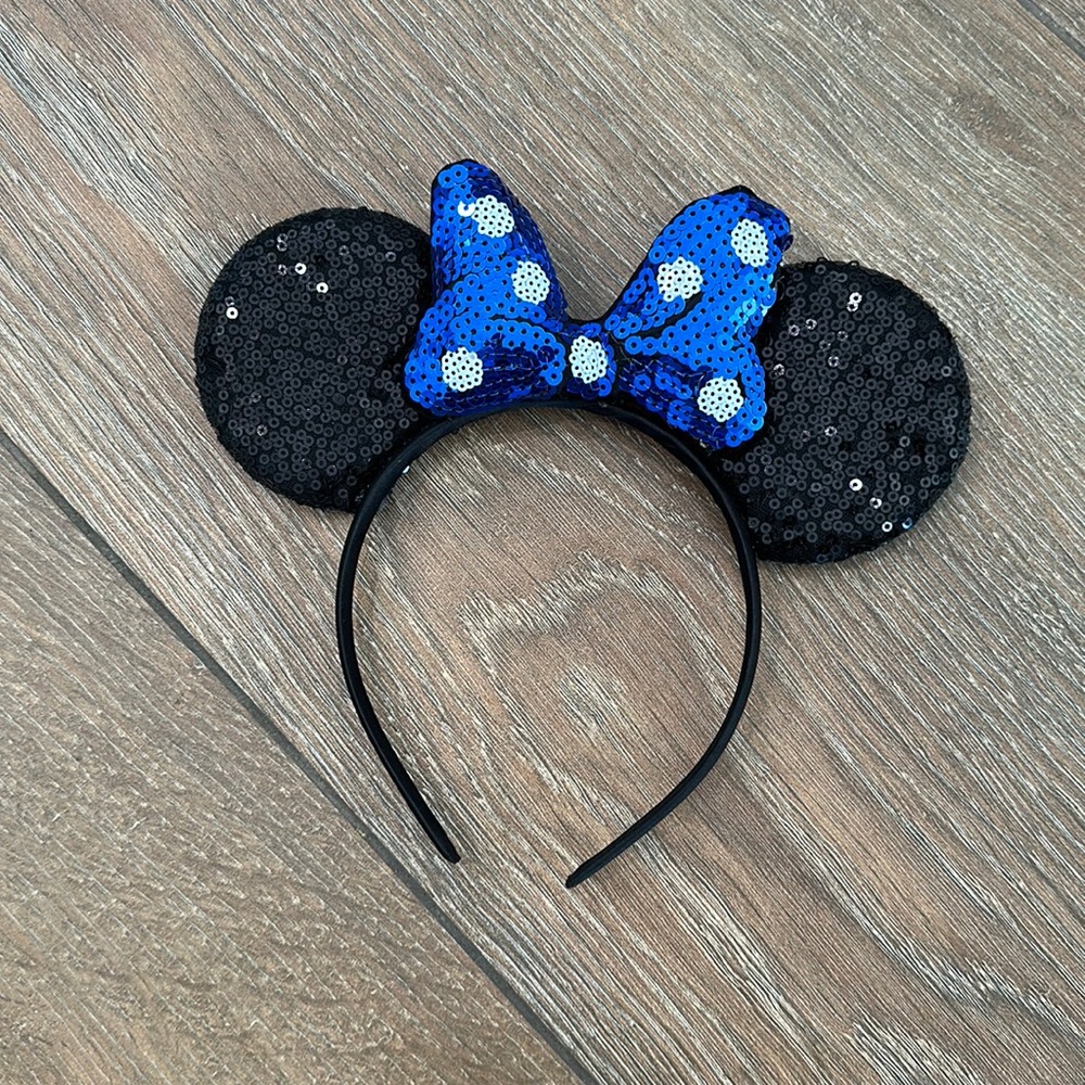 Mickey Mouse headband ears. Color black with blue polkadot bow.
